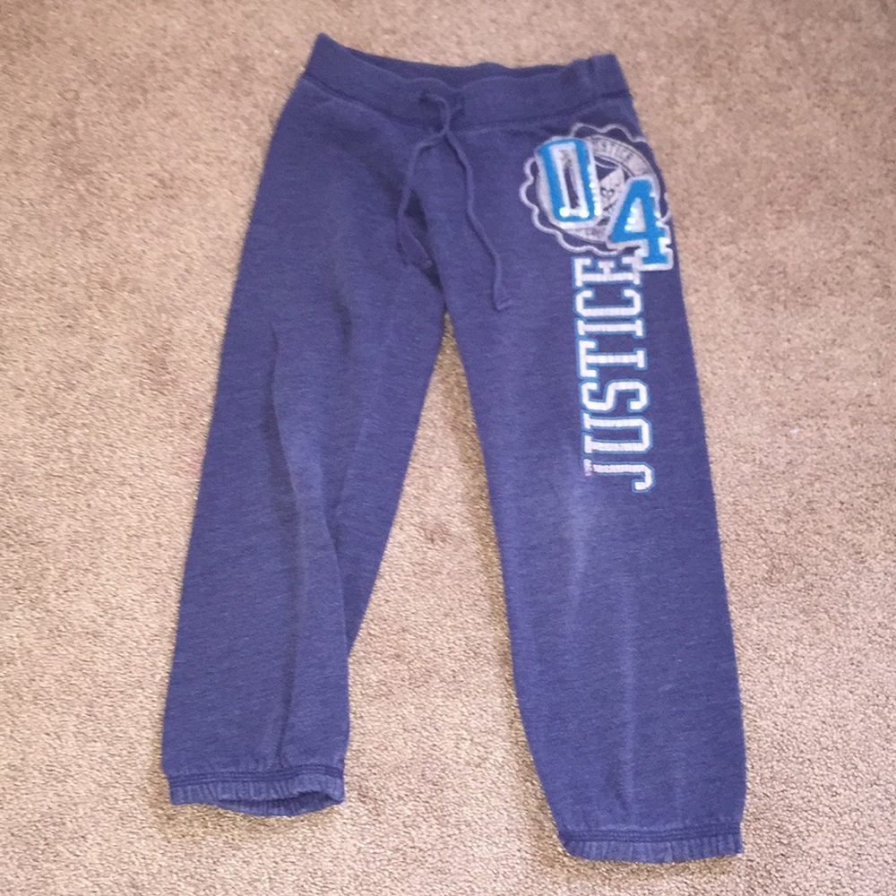 Navy “Justice” sweatpants.